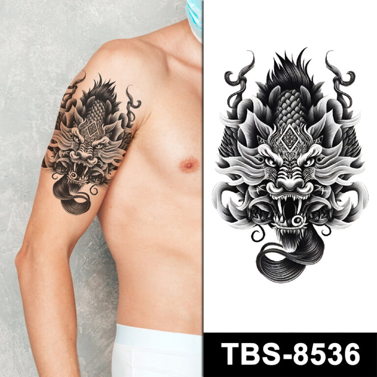Black dragon mask tattoo on arm